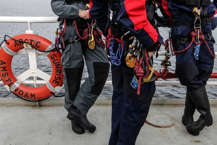 Climbers with Greenpeace on the Arctic Sunrise in the Barents Sea. Photo: Igor Podgorny, July 2012